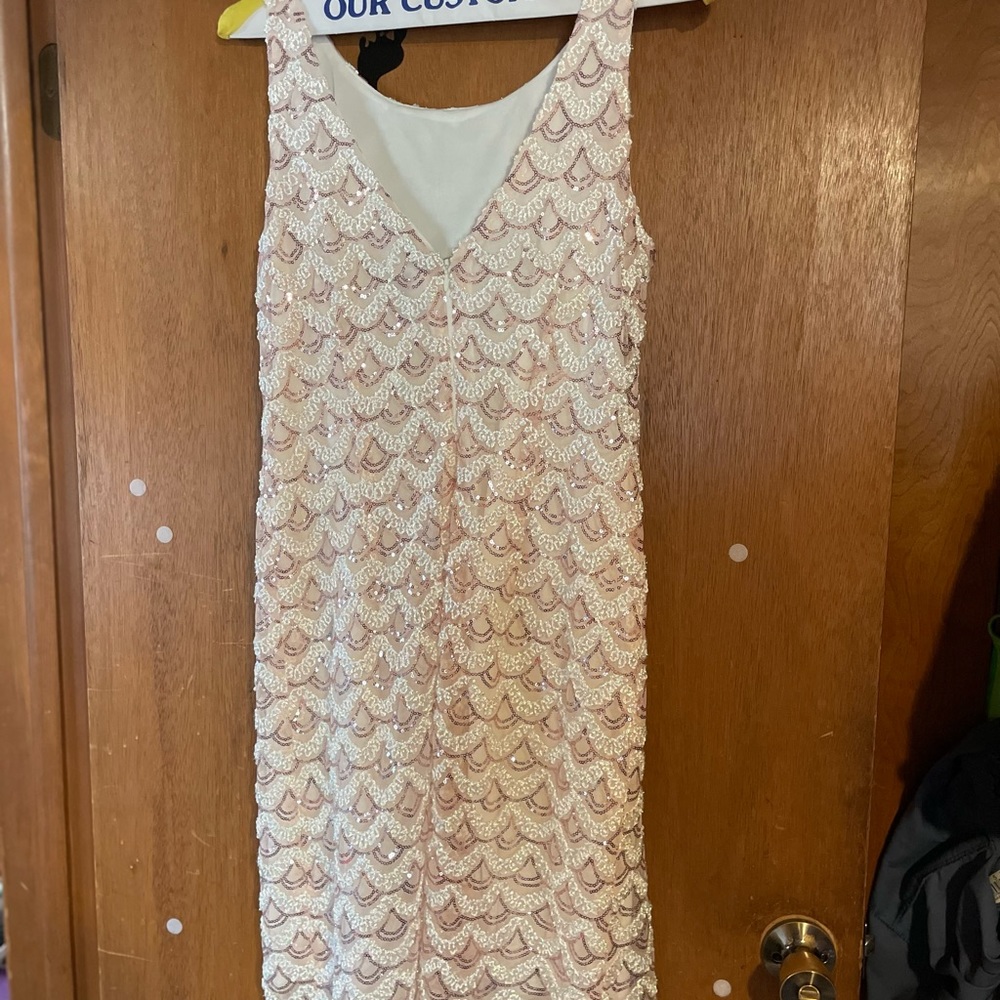 Champagne size 12p beautiful dress. Back dropping into a v. Worn two times